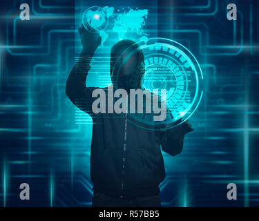 Hooded man with mask using virtual screen to hacking Stock Photo