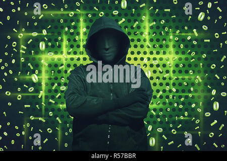 Computer hacker with mask standing Stock Photo