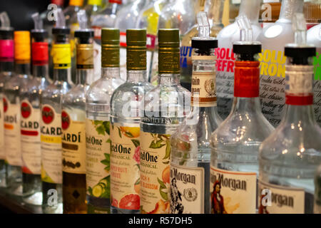 Glass Liquior Bottles Lined up on a Shelf Room for Copy Vivid Images Stock Photo