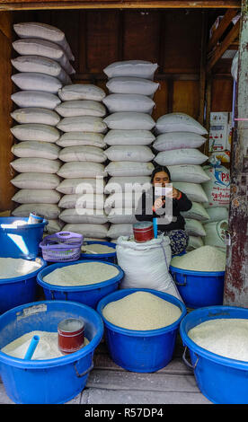 Taunggyi, Myanmar - Feb 8, 2018. Selling rice at market in Taunggyi, Myanmar. Taunggyi is the capital of Shan State and the biggest city in eastern My Stock Photo