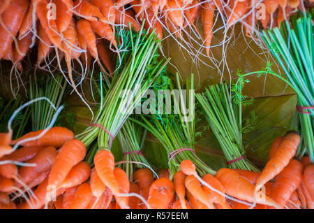 Close up little carrot fresh market with root and leaf background Stock Photo