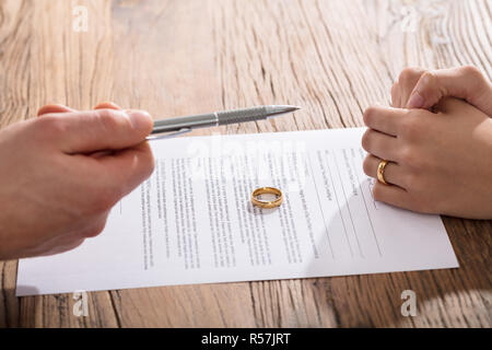 Couple Signing Divorce Paper Stock Photo