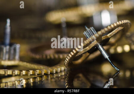 Watch Parts: Damaged Vintage Metallic Watch Gears on a Black Surface Stock Photo