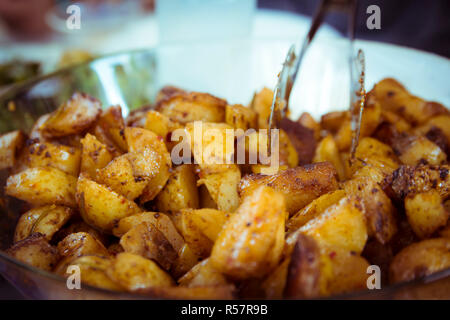 Baked potatoes in a glass bowl Stock Photo