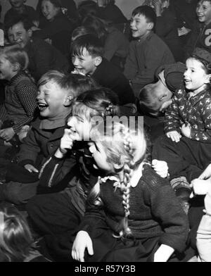 Original caption: 'Sweeney Steps Out.' Sweeney is the star of one of the many instructive and entertaining movie shorts the Linz, Upper Austria American House lends to volunteer operators who display them at rural schools and social centers. Stock Photo