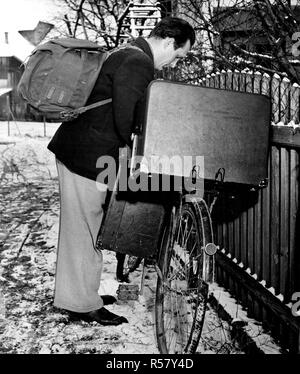 Original caption: 'Sweeney Steps Out.' Sweeney is the star of one of the many instructive and entertaining movie shorts the Linz, Upper Austria American House lends to volunteer operators who display them at rural schools and social centers. Stock Photo