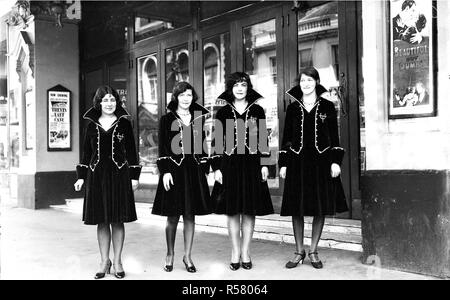Usherettes standing in the doorway of the New Strand Theatre, Liverpool Street, Hobart (1930) - Mandatory Photo Credit: TAHO Stock Photo