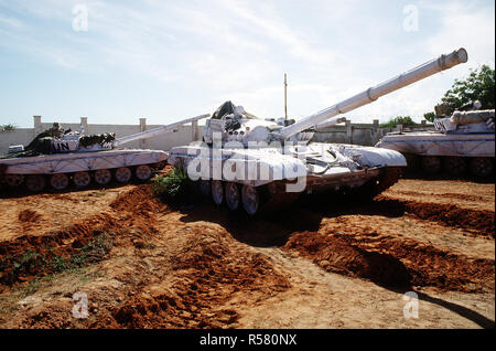 United Nations tanks at the Belgian compound in Kismayo.  3/4 right side view of a T-72 main battle tank with UN markings.  The UN forces are in Somalia in support of OPERATION CONTINUE HOPE.