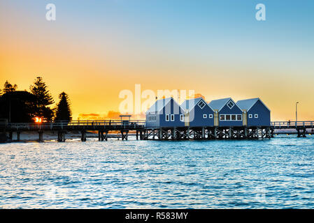 Beautiful sunset at wooden Busselton jetty in Western Australia - longest timber piled jetty in the southern hemisphere, with  tourists silhouettes Stock Photo