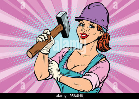 Construction worker with hammer. Woman professional Stock Photo