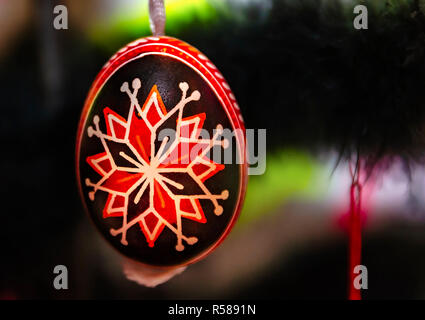 An Easter egg from the Czech Republic, a kraskice egg, hangs on a tree at the Mobile International Festival, Nov. 17, 2018, in Mobile, Alabama. Stock Photo