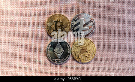 Lying on the background. Coin Crypto Currencies. virtual money FromColot and silver in appearance Stock Photo