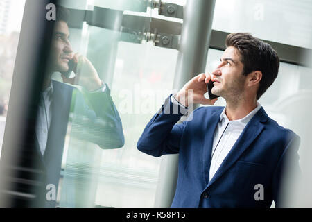 Businessman talk to mobile phone Stock Photo