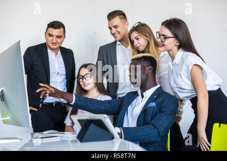 Company employees working in software development and designer office Stock Photo