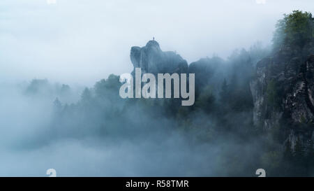 Witch figure over the mist at the Bastai, Saxon Switzerland, Elbe Sandstone Mountains, Saxony, Germany Stock Photo