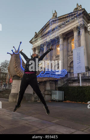 London, UK.  30 November 2018. Turner Prize nominated artist Monster Chetwynd poses in front of her new Tate Britain Winter Commission.  The artist, formerly known as 'Marvin Gaye' and 'Spartacus', has transformed Tate Britain’s iconic Neo-Classical façade to mark the winter season with a new piece inspired by the winter solstice, involving a dazzling light display and elements of sculpture.  Winter Commission 2018: Monster Chetwynd will be switched on daily from 1st December 2018 - 28 February 2019.  Credit: Stephen Chung / Alamy Live News