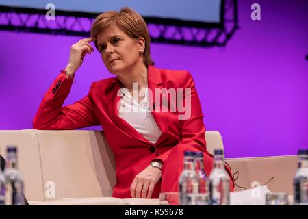 Edinburgh, Scotland, UK. 30th November, 2018. First Minister of Scotland, Nicola Sturgeon takes part in the conference closing session of Eurocities 2018.  She shares the stage with Young Ambassadors as they reflect on their conclusions from the three day conference in a session chaired by BBC journalist Allan Little.  Established in 1986, EUROCITIES is the network of major European cities, bringing together local governments that are responsible for 130 million citizens across 39 countries. Credit: Rich Dyson/Alamy Live News Stock Photo