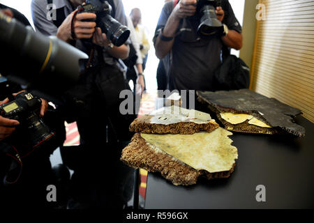 Putrajaya, Malaysia. 30th November, 2018. Photographers take pictures of possible debris of the missing MH370 in Putrajaya, Malaysia, Nov. 30, 2018. Malaysian Transport Minister Anthony Loke Siew Fook said Friday the government was open to resuming the search for Malaysia Airlines Flight MH370 but that requires 'new credible evidence.' MH370, carrying 239 on board, went missing en route from Kuala Lumpur to Beijing on March 8, 2014. Its main wreckage is yet to be found. (Xinhua/Chong Voon Chung) Credit: Xinhua/Alamy Live News Stock Photo