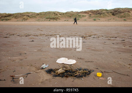 Crosby, Merseyside. 30th Nov 2018. UK Weather. UK Storm Diana beach debris on the shoreline. The inevitable assortment of plastic debris washed up by the tide and deposited on the famous beach near Liverpool. Crosby beach is known as a Another Place and is the site of an iron men installation of 100 figures by the artist Antony Gormley. Credit: MediaWorldImages/AlamyLiveNews. Stock Photo