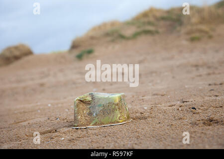 Crosby, Merseyside. 30th Nov 2018. UK Weather. UK Storm Diana beach debris on the shoreline. The inevitable assortment of plastic debris washed up by the tide and deposited on the famous beach near Liverpool. Crosby beach is known as a Another Place and is the site of an iron men installation of 100 figures by the artist Antony Gormley. Credit: MediaWorldImages/AlamyLiveNews. Stock Photo