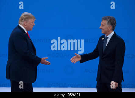 Buenos Aires, Argentina. 30th Nov, 2018. Donald Trump (l), President of the United States, is welcomed by Mauricio Macri, President of Argentina, at the G20 Summit Meeting Centre in Buenos Aires. From 30.11.-1.12.2018 the G20 summit will take place in Buenos Aires. The 'Group of 20' unites the strongest industrial nations and emerging economies. Credit: Ralf Hirschberger/dpa/Alamy Live News Stock Photo