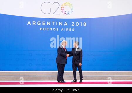 Buenos Aires, Argentina. 30th Nov, 2018. Argentine President Mauricio Macri, right, welcomes U.S. President Donald Trump at the start of the G20 Summit meeting at the Costa Salguero Center November 30, 2018 in Buenos Aires, Argentina. Credit: Planetpix/Alamy Live News Stock Photo