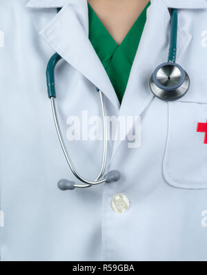 Doctor wear white uniform and green scrubs uniform inside. Doctor with stethoscope hang on neck. Healthcare professional. Patient trust concept. Stock Photo