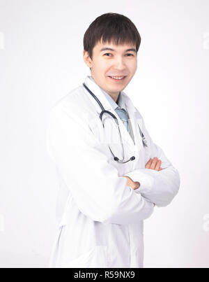 portrait of young doctor with Asian appearance isolated on white background Stock Photo