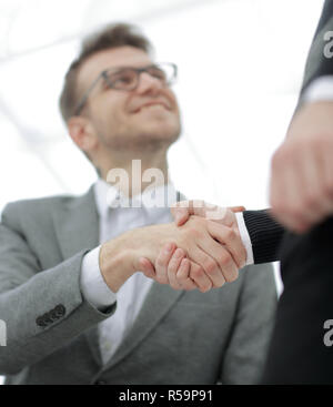 Manager and the client shake hands when meeting in the office Stock Photo