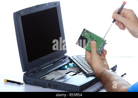 it specialist repairs laptop Stock Photo