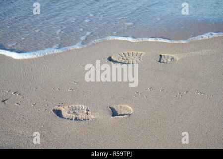 shoe marks in the sand Stock Photo