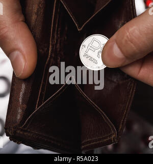 Russian ruble on the background of an open empty wallet. Concept on the lack of money Stock Photo