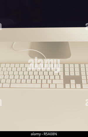 White keyboard, mouse and succulent plant on desk. Copy space. Top view. Stock Photo