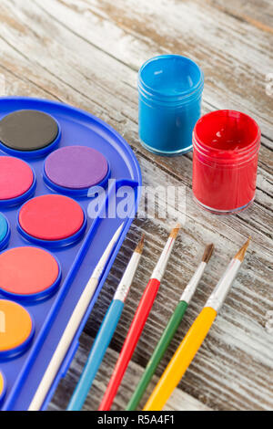 paint brushes on wooden background, special tools for creative people, back to school, education background Stock Photo