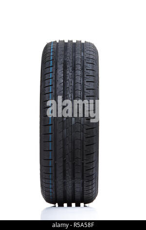 Stack of brand new high performance car tires on clean high-key white studio background Stock Photo