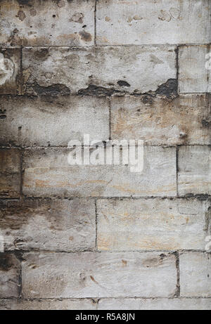 Wall of gray travertine adarce stone bricks Stock Photo