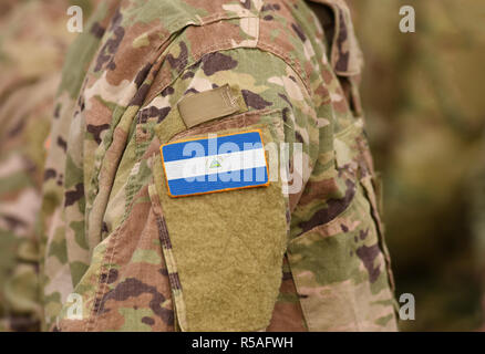 Flag of Nicaragua on soldiers arm (collage). Stock Photo