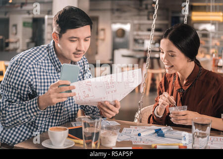 Two creative professional interior designers working on new project Stock Photo