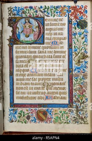 Historiated initial from manuscript page of Book of Hours. Book of Hours, Use of Tournai, imperfect. Netherlands, S. (Ghent-Tournai area). 2nd quarter of the 15th century. Historiated initial 'D'(omine) with the Resurrection of the Souls combined with a three-sided bar border and a full border with acanthus leaves, flowers, birds, a peacock, an archer, a coat of arms and a lion playing the trumpet at the beginning of the Penitential Psalms. Source: Harley 2433 f.81. Language: Latin and Dutch. Stock Photo