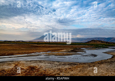 The 'Mountain of God' (Masai language Ol Doinyo Lengai) active volcano on the southern shores of Lake Natron in the Arusha area of northern Tanzania Stock Photo