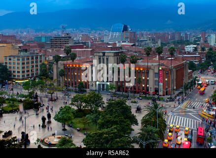 Medellin, Colombia,  Plaza Botero, Sculptures Of Fernando Botero, Museum Of Antioquia, Art Deco, Dusk, Motion, Taxis, Andes Mountains, Aburra Valley Stock Photo