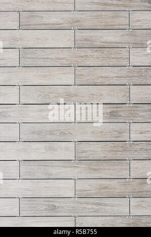 Walls and building tiles. The texture of the tiles. The colors of ceramic tiles with a touch of wood. Different shades. Stock Photo