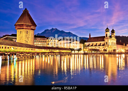 Luzern Kappelbrucke bridge and church with Pilatus mountain background evening view, central Switzerland Stock Photo