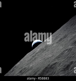 (7-19 Dec. 1972) --- The crescent Earth rises above the lunar horizon in this spectacular photograph taken from the Apollo 17 spacecraft in lunar orbit during the final lunar landing mission in the Apollo program. Stock Photo