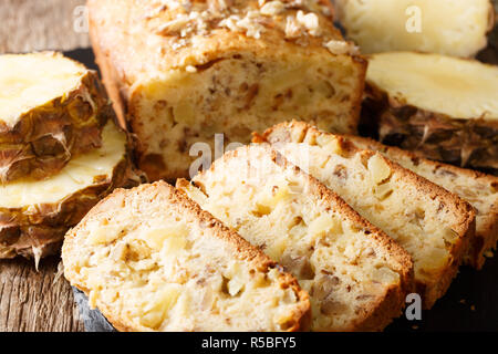 Delicious homemade pineapple bread with walnuts close-up on the table. horizontal Stock Photo