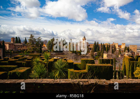 The Alhambra is a palace and fortress complex located in Granada, Andalusia, Spain. It was originally constructed as a small fortress in AD 889 on the Stock Photo