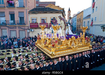 Religious float being carried through the streets during Semana Santa, (Holy Week) celebrations, Malaga, Andalucia, Spain Stock Photo