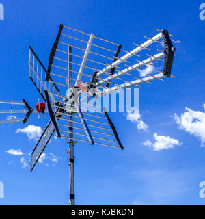 TV antenna against bright sky Stock Photo