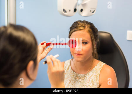 Woman undergoing orthoptic check-up with an orthoptist, France. Stock Photo