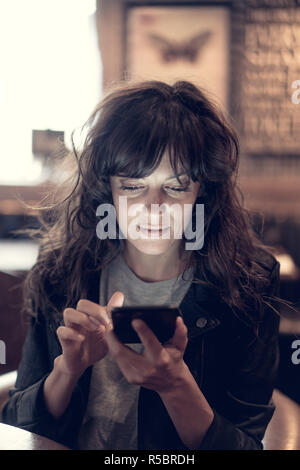 Woman using smartphone. Stock Photo